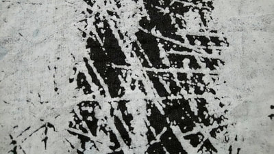 Printed textile sample: black cotton linen, blank discharge screen print.
